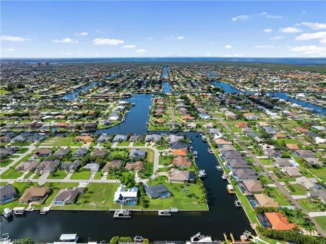 Aerial view showcasing the extensive network of canals throughout the community, with numerous properties featuring waterfront access