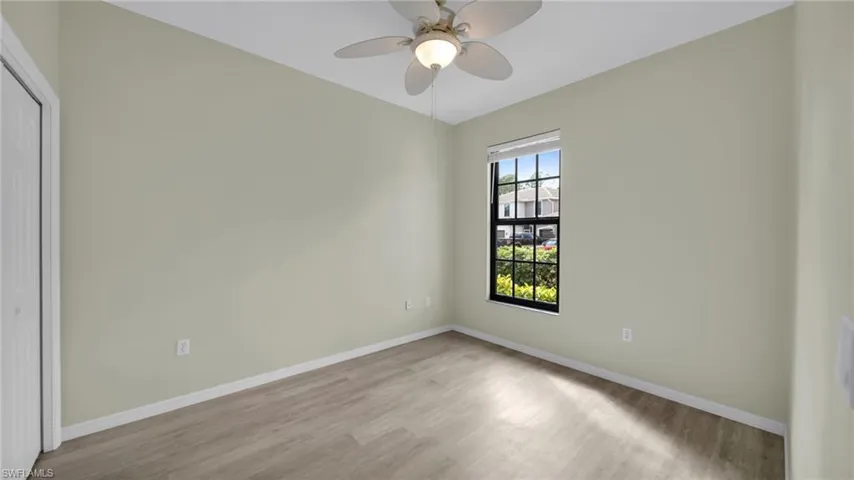 Spare room featuring wood finished floors and ceiling fan