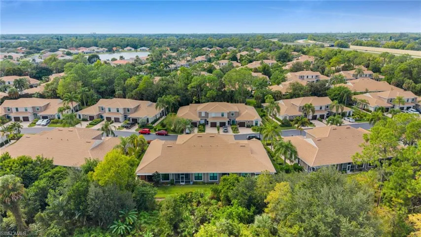 Aerial view of residential area with a tree filled landscape