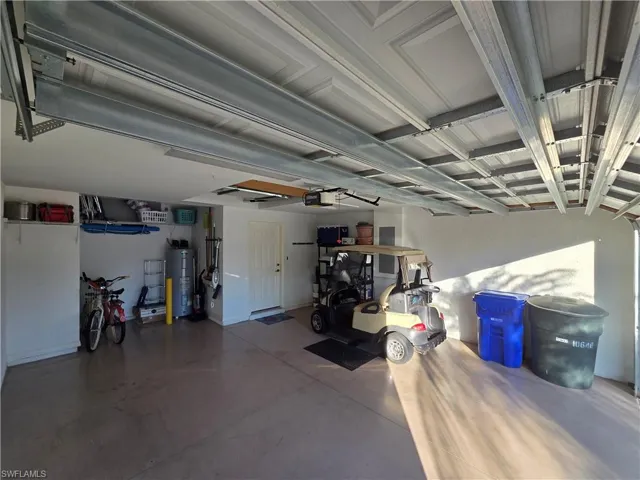 Garage featuring electric water heater