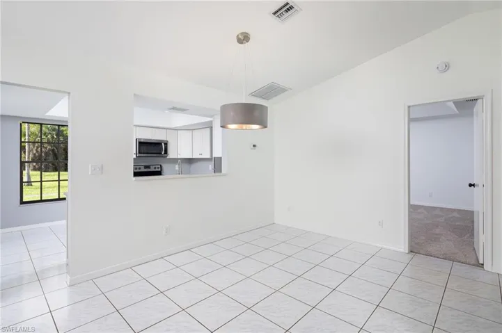 Dining Area with pass-through window to kitchen.