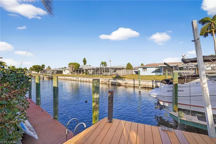 Dock featuring a residential view and a water view