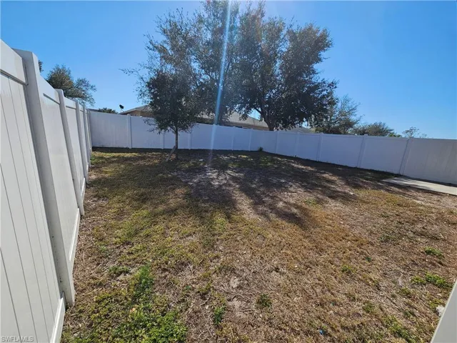 View of fenced backyard