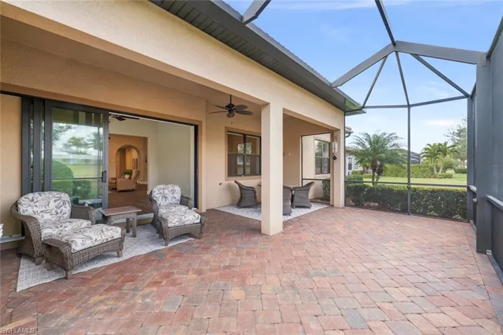 View of patio / terrace featuring a ceiling fan, outdoor lounge area, and a lanai