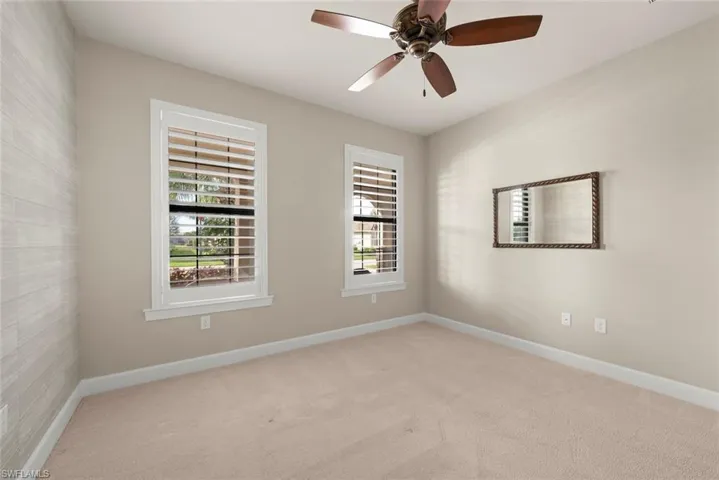 First Bedroom featuring carpet natural light, light colored carpet,