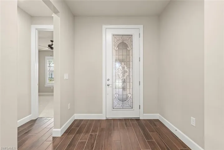 Foyer featuring  tile floors and leaded glass entry door
