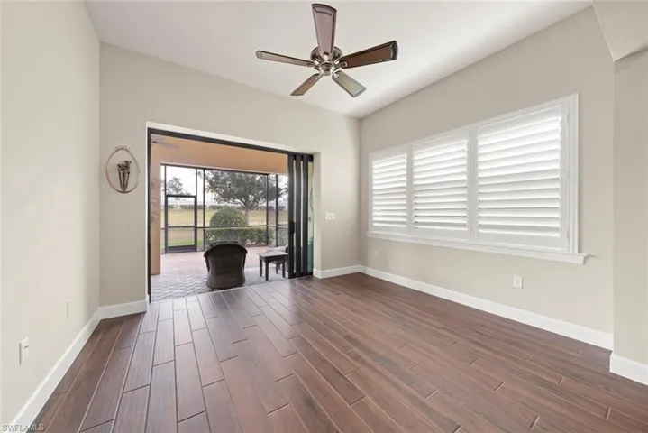 Sun room featuring  tile finish floors and ceiling fan