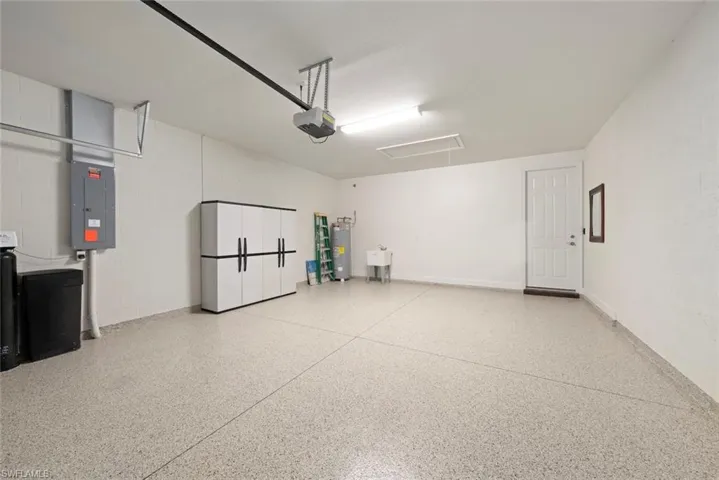 Garage with kinetico water system, and new floor epoxy & drop down ladder for storage
