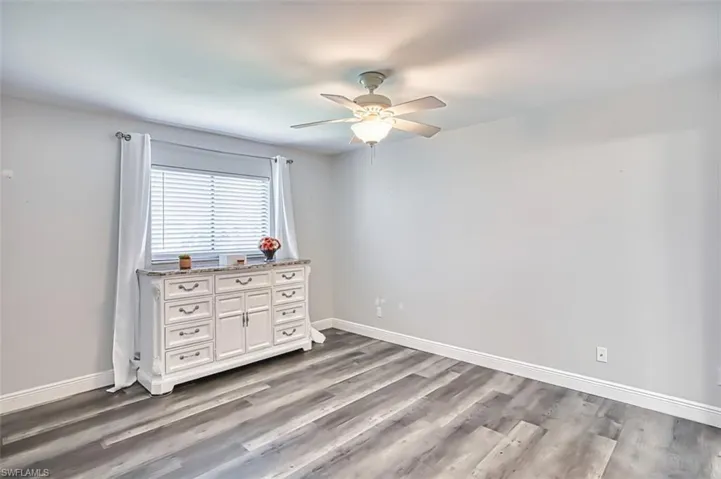 Bedroom featuring light wood-style flooring and ceiling fan