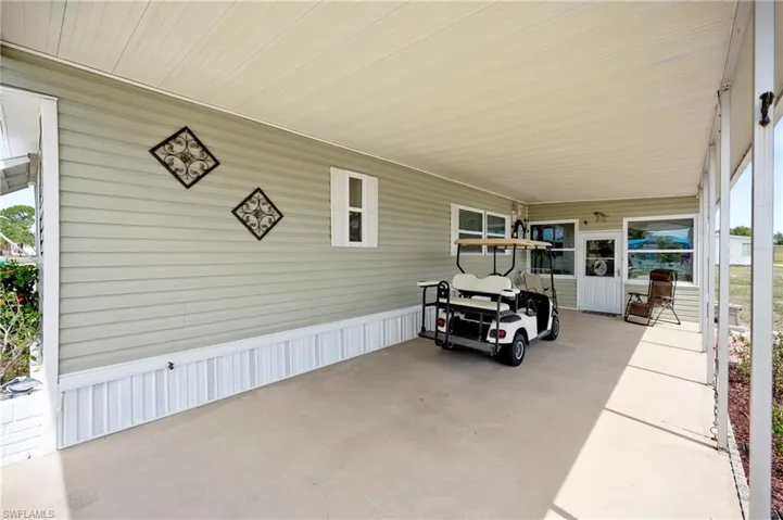 View of patio featuring an attached carport