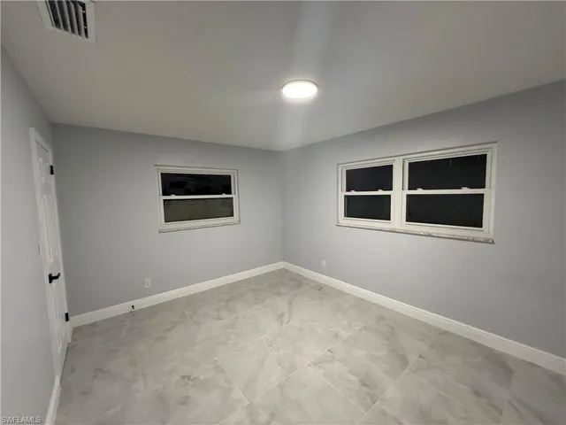 Empty room with baseboards