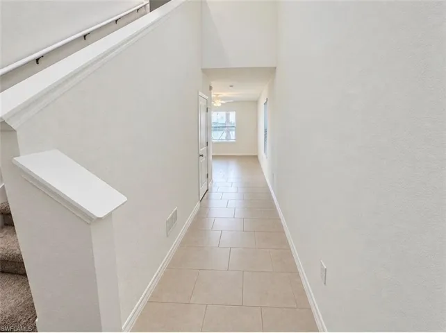 Tile flooring extending through the hallway