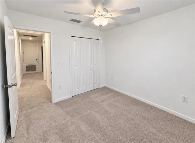 Neutral-toned carpeting throughout