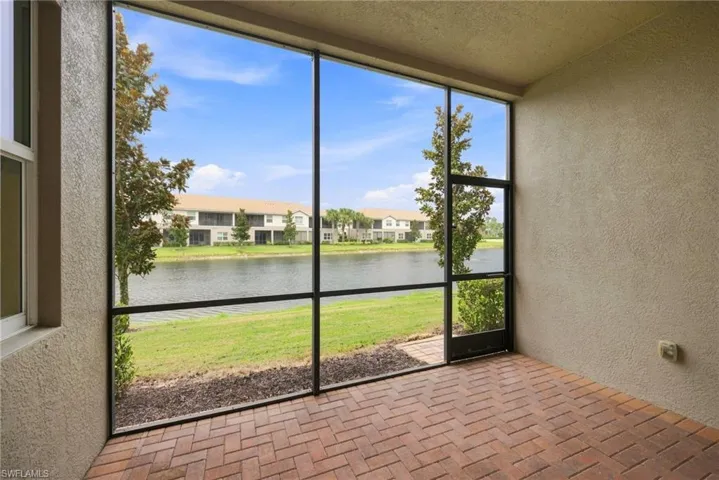 Southern exposure with a view of the lake and one building away from visitor parking.