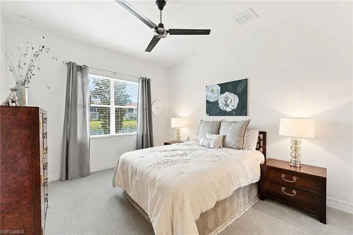 Master Bedroom with view of the lake and a large walk in closet.