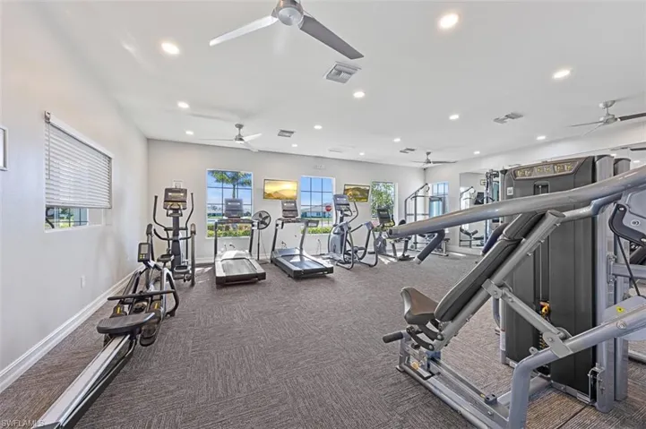 Gym with recessed lighting, carpet, and a ceiling fan