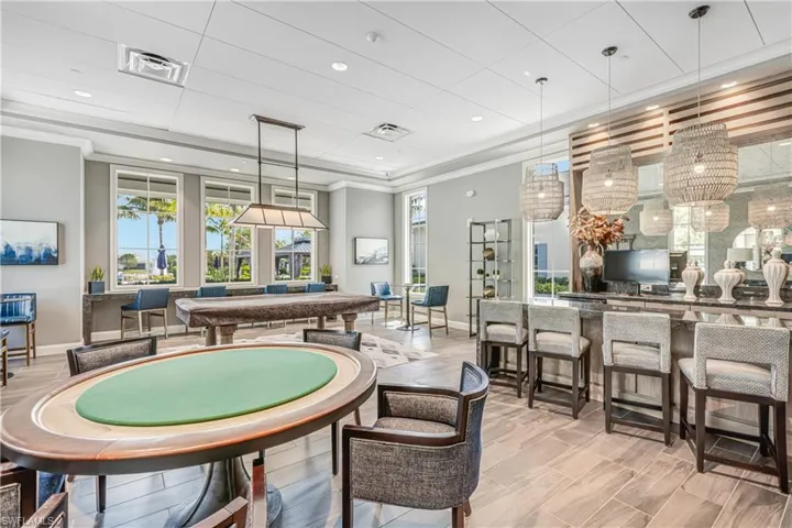 Rec room with crown molding and pool table