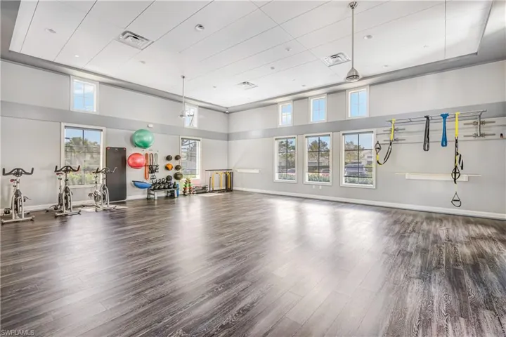 Gym featuring a high ceiling