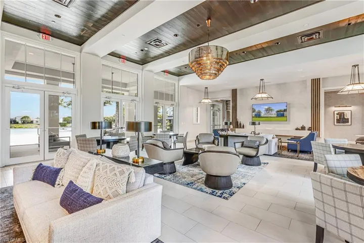Lobby featuring a wood ceiling with exposed beams and recessed lighting