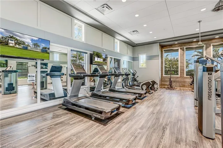 Exercise room featuring recessed lighting