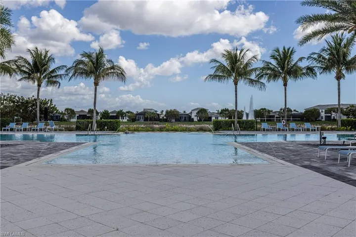 Community pool featuring a residential view and a patio area