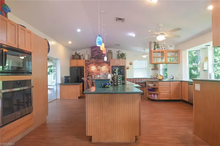 Built-in Microwave, (2) ovens, Breakfast Bar with Pendant Lighting!