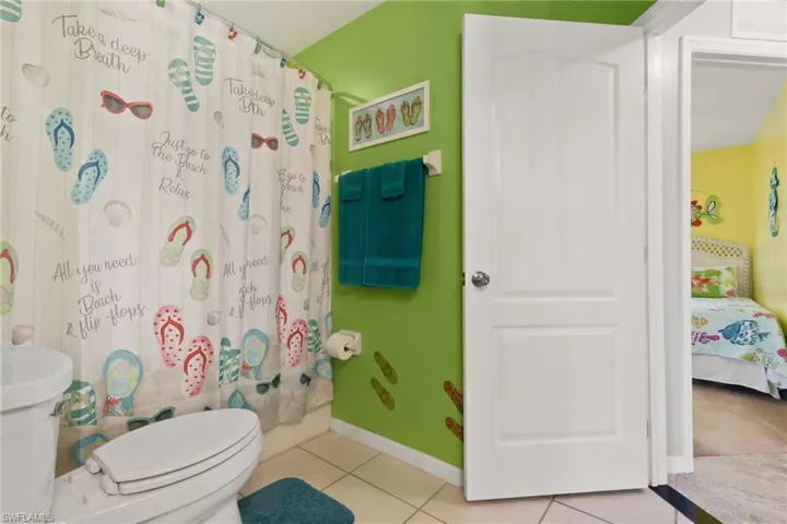 Bathroom with tile patterned floors and toilet