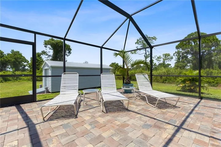 View of patio / terrace featuring a lanai