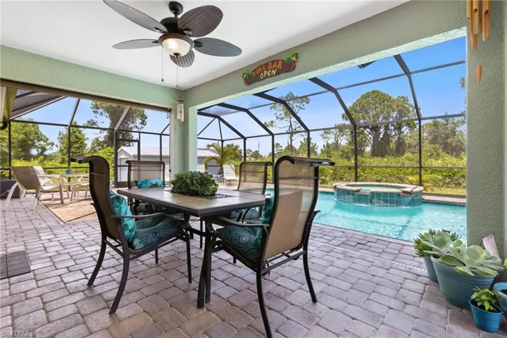 Sunroom featuring ceiling fan