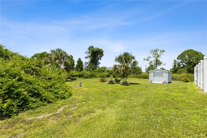 View of yard with an outbuilding