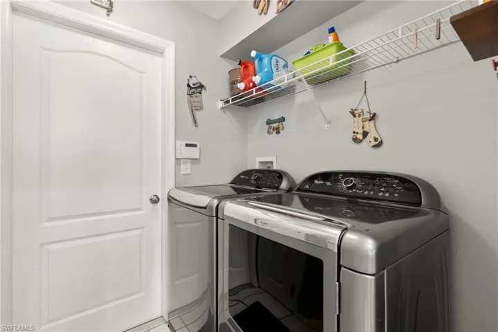 Laundry room featuring washer and clothes dryer
