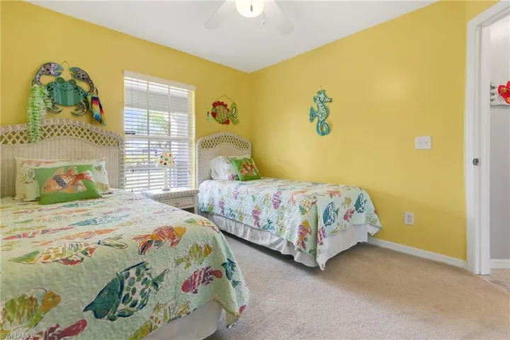 Bedroom featuring carpet flooring and ceiling fan