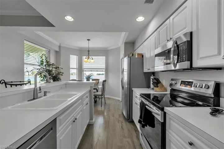 Kitchen looking at breakfast nook and lake beyond