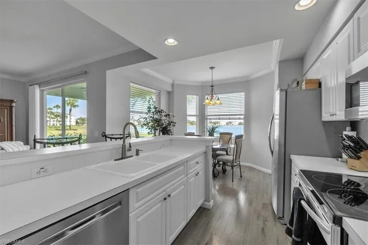 Kitchen looking at breakfast nook and lake beyond