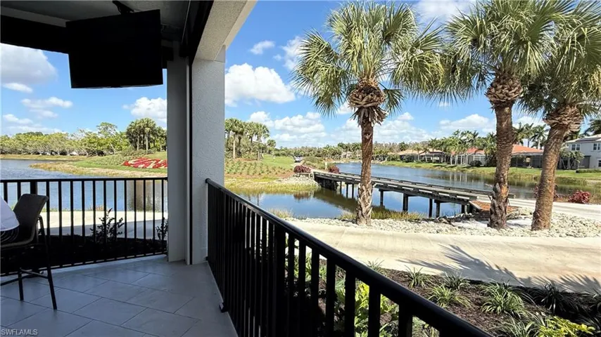 Outdoor bar seating at The Oasis overlooking the golf course
