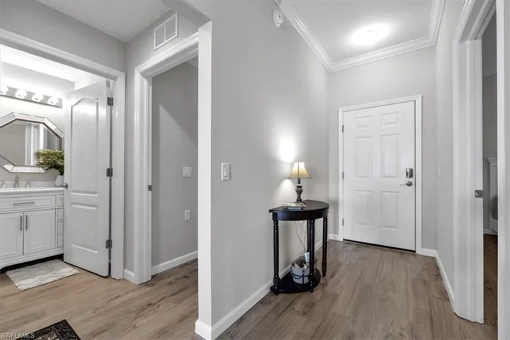 Guest room and bath with plank flooring