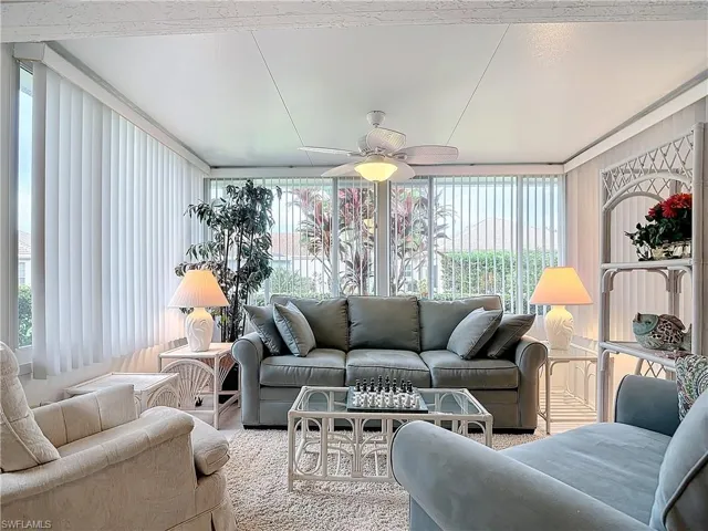 3rd bedroom w/pullout sofa and curtains/den