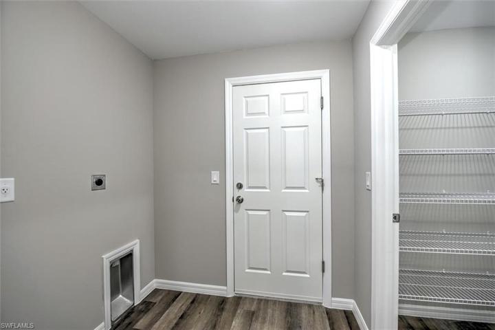 Utility room with bonus pantry for storage.