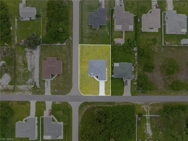 Aerial overview of property's location featuring nearby suburban area