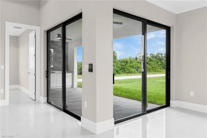 Doorway featuring marble tiled flooring and crown molding