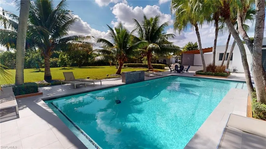 View of pool featuring a yard and a patio