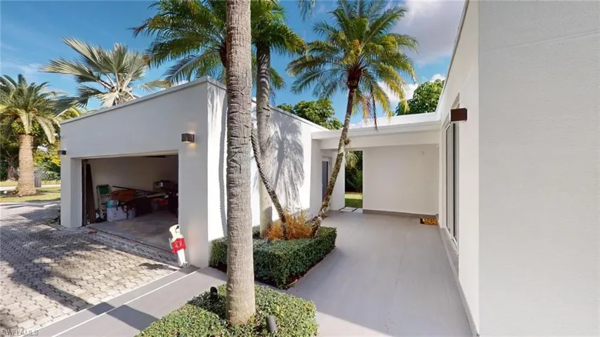 View of property exterior featuring a garage