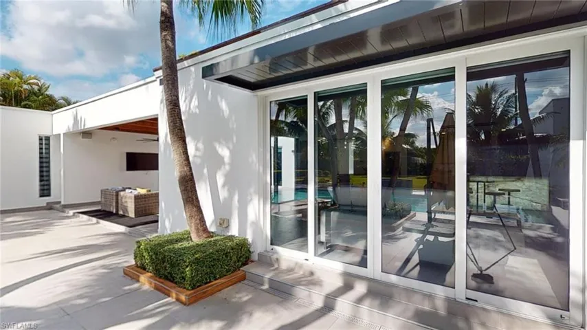 Doorway to property featuring a patio area
