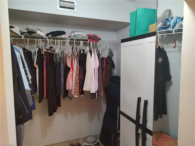 Walk in closet and an owner's cabinet