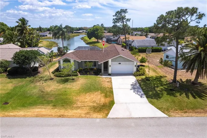 Aerial view with a water view and a residential view