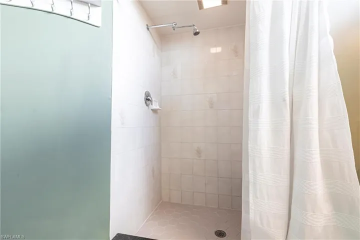 Bathroom with tiled shower