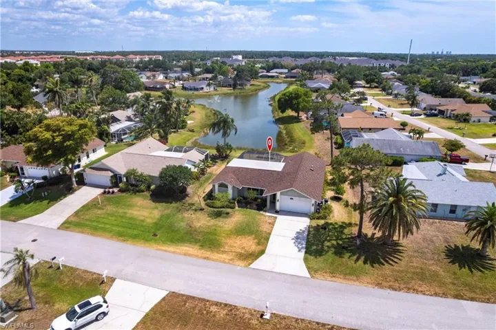 Bird's eye view with a water view and a residential view