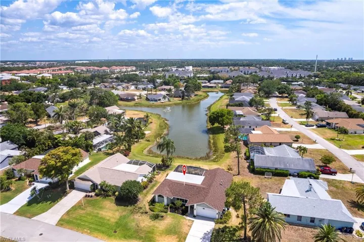 Aerial view with a water view and a residential view
