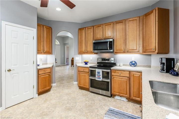 Large kitchen with newer stainless steel appliances appliances