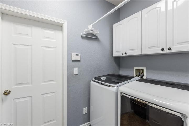 Laundry room with newer washer and dryer